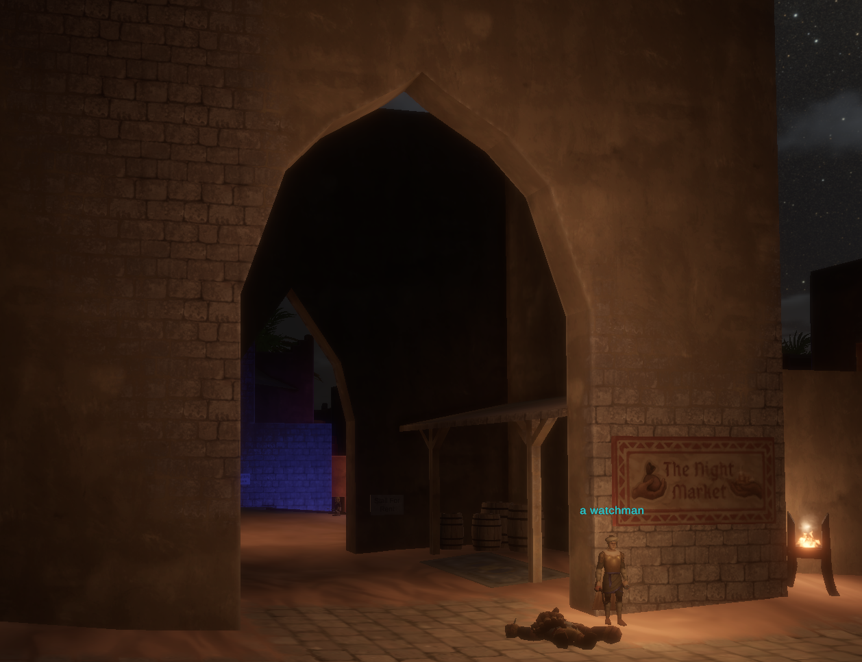 Signed arched entrance to the Night Market at night